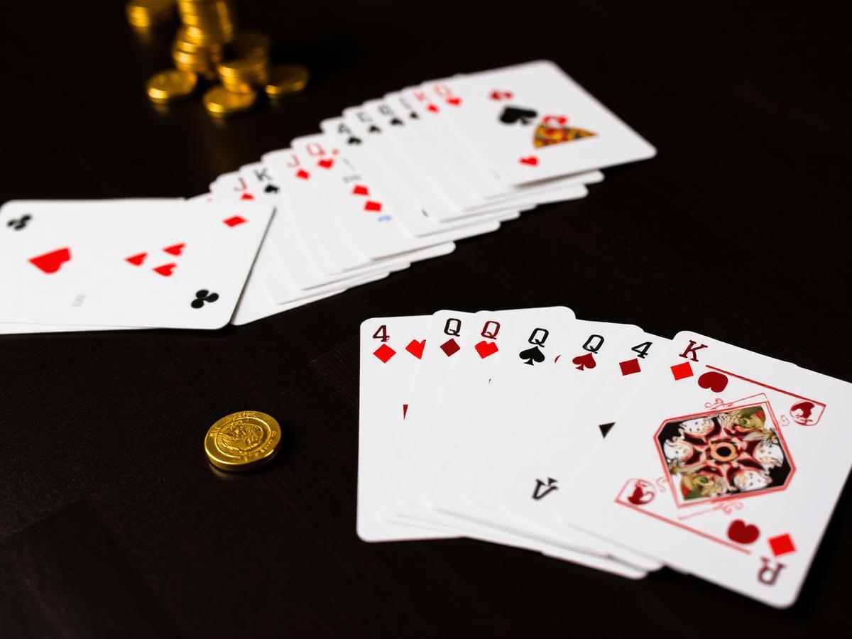 Teen Patti, Rummy and Poker cards laid out on a 10cric card games table